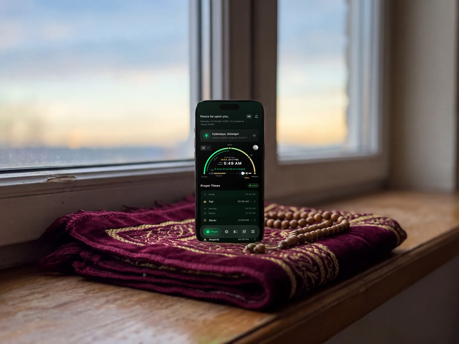 iPhone dengan waktu solat di atas sejadah